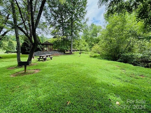 196 Moriah Drive Rutherfordton, NC 28139 - Photo 41 of 48 a view of a backyard with a garden and trees