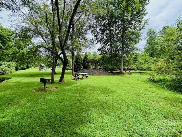 196 Moriah Drive Rutherfordton, NC 28139 - Photo 45 of 48 a park with a bench and trees