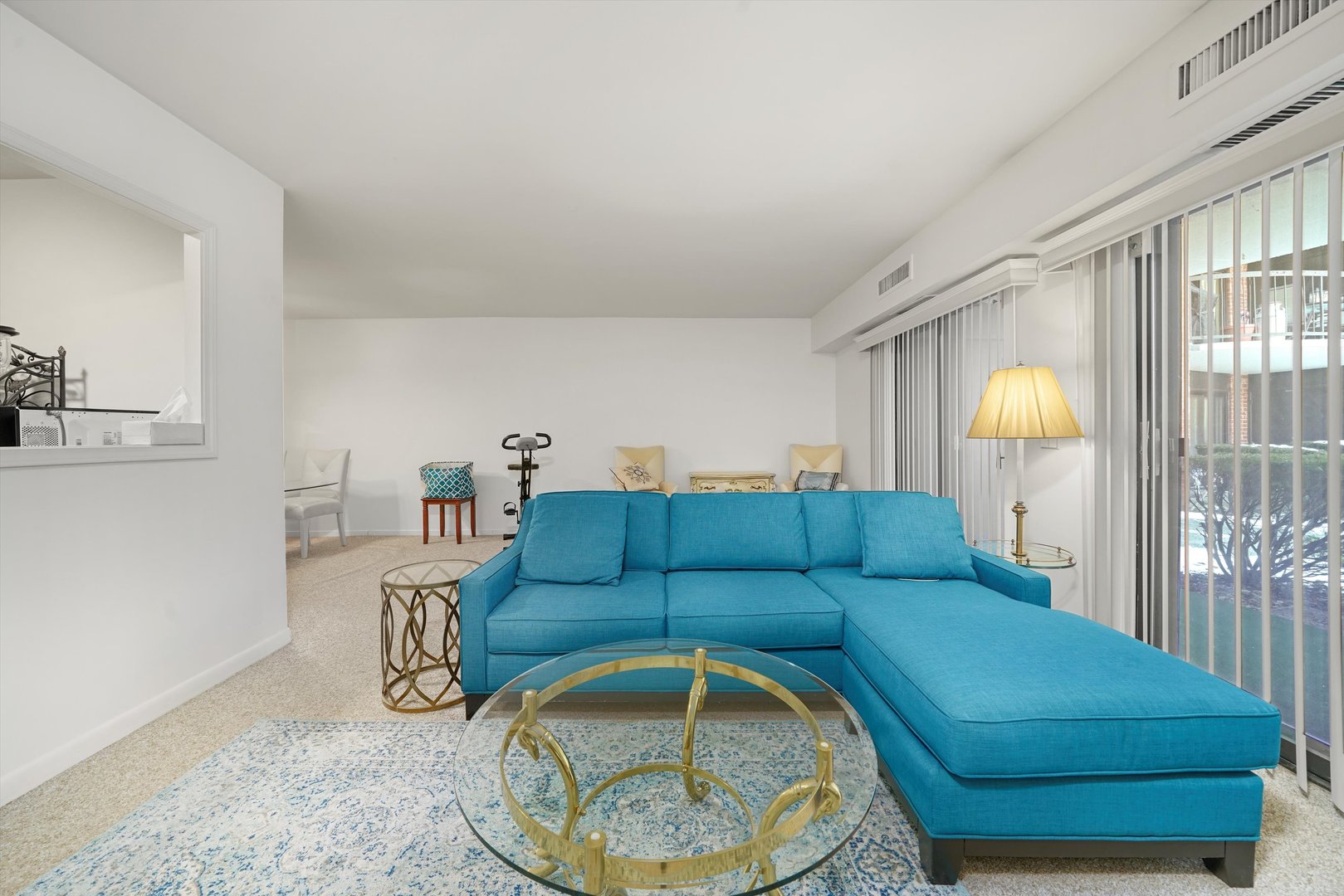 1405 East Central Road, Unit 110B Arlington Heights, IL 60005 - Photo 12 of 33 a living room with furniture and a lamp