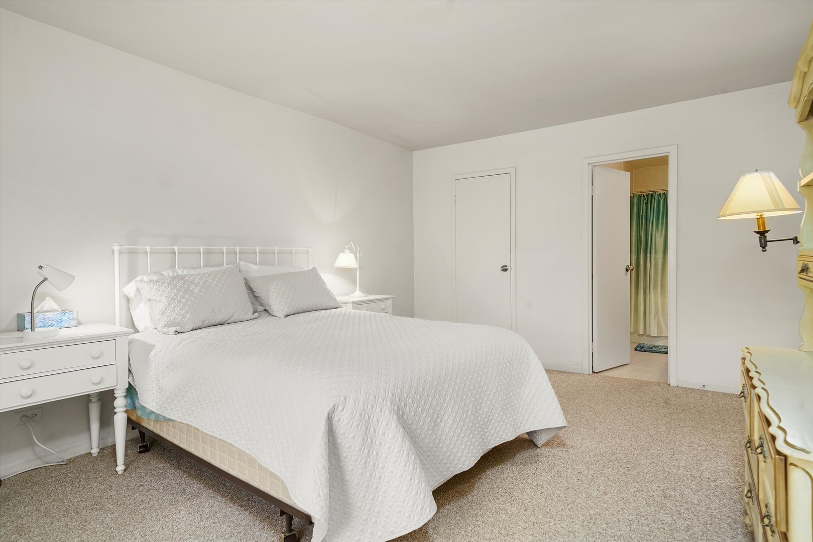 1405 East Central Road, Unit 110B Arlington Heights, IL 60005 - Photo 17 of 33 a bedroom with a bed and a lamp