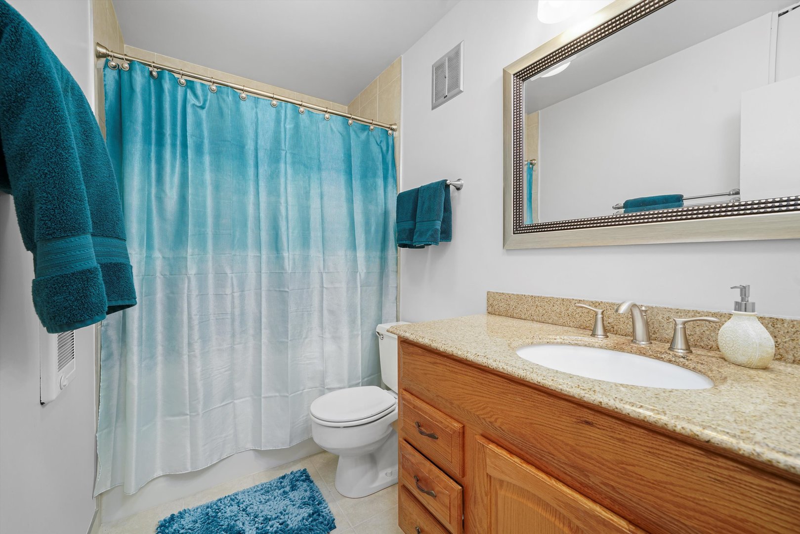 1405 East Central Road, Unit 110B Arlington Heights, IL 60005 - Photo 18 of 33 a bathroom with a granite countertop sink toilet and shower