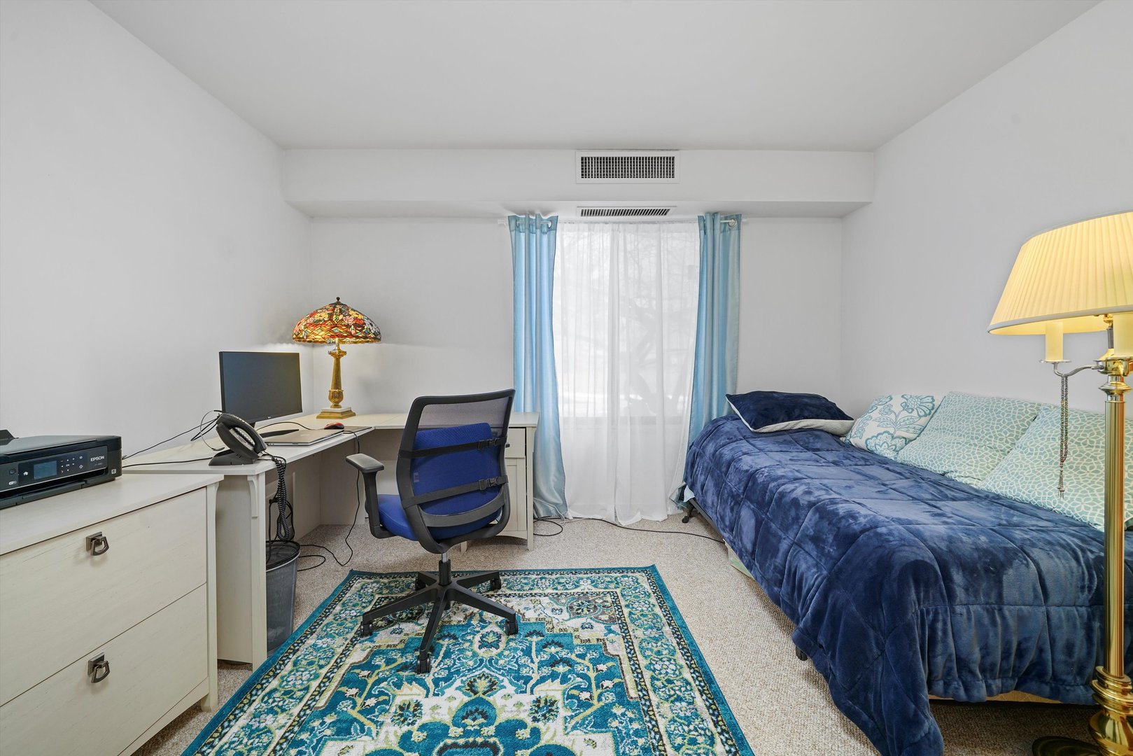 1405 East Central Road, Unit 110B Arlington Heights, IL 60005 - Photo 25 of 33 a bedroom with a bed and a desk