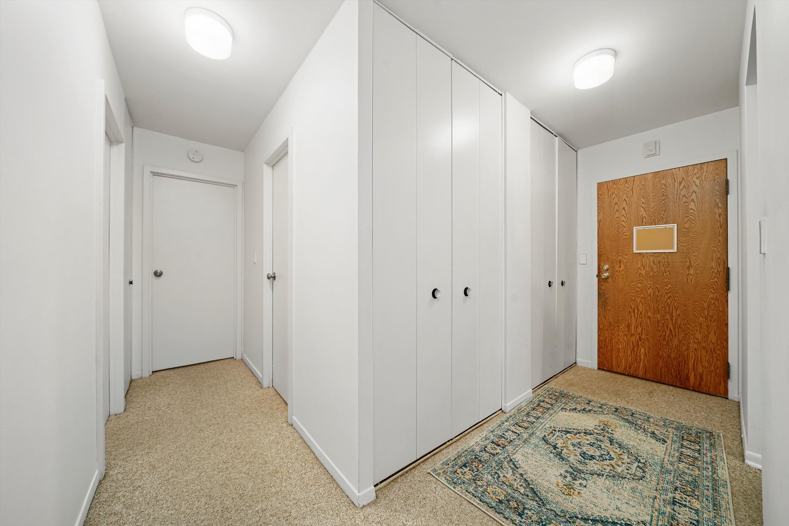 1405 East Central Road, Unit 110B Arlington Heights, IL 60005 - Photo 27 of 33 a view of a big room with closet and wooden floor