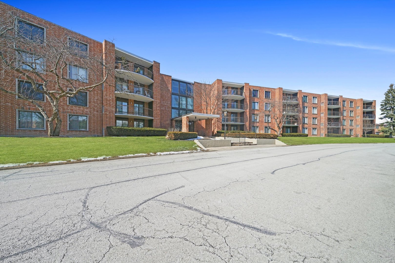 1405 East Central Road, Unit 110B Arlington Heights, IL 60005 - Photo 30 of 33 a view of buildings with yard