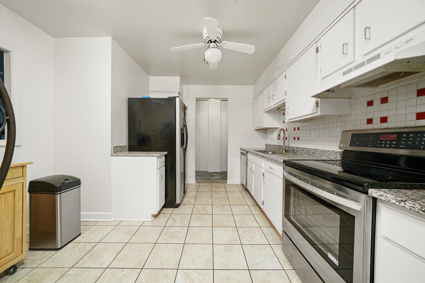 1405 East Central Road, Unit 110B Arlington Heights, IL 60005 - Photo 5 of 33 a kitchen with stainless steel appliances a stove a refrigerator and a sink