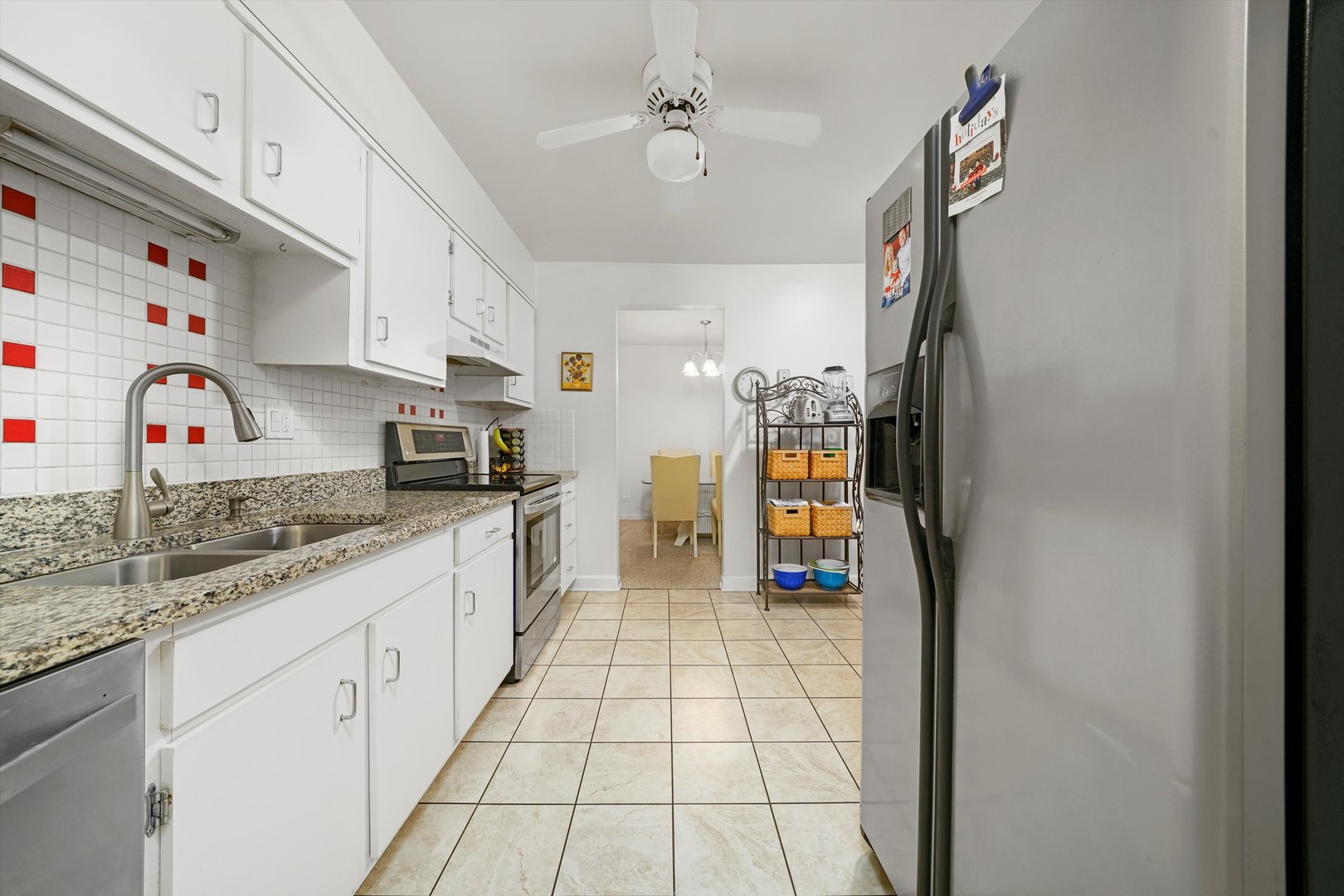 1405 East Central Road, Unit 110B Arlington Heights, IL 60005 - Photo 6 of 33 a kitchen with stainless steel appliances granite countertop a sink and cabinets