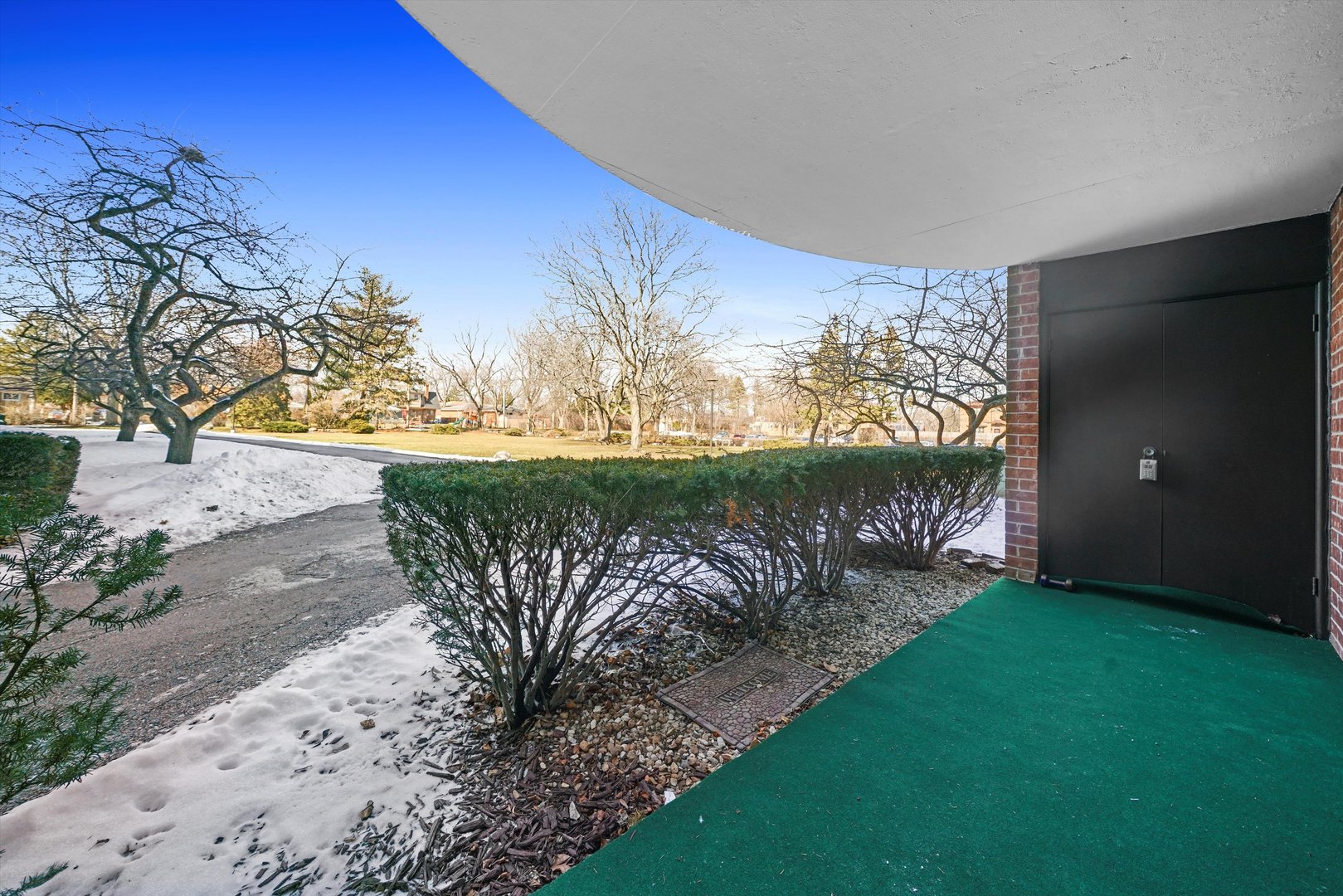 1405 East Central Road, Unit 110B Arlington Heights, IL 60005 - Photo 7 of 33 a view of a backyard