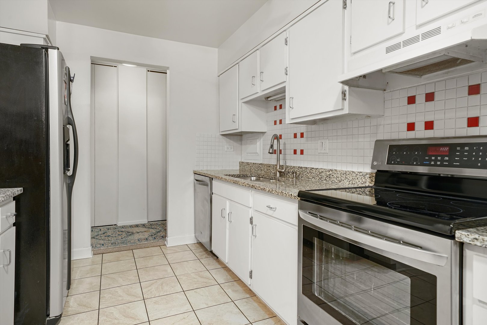 1405 East Central Road, Unit 110B Arlington Heights, IL 60005 - Photo 9 of 33 a kitchen with stainless steel appliances granite countertop a sink stove and refrigerator