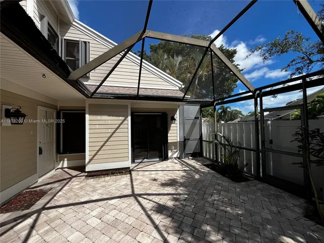 a house with trees in the background