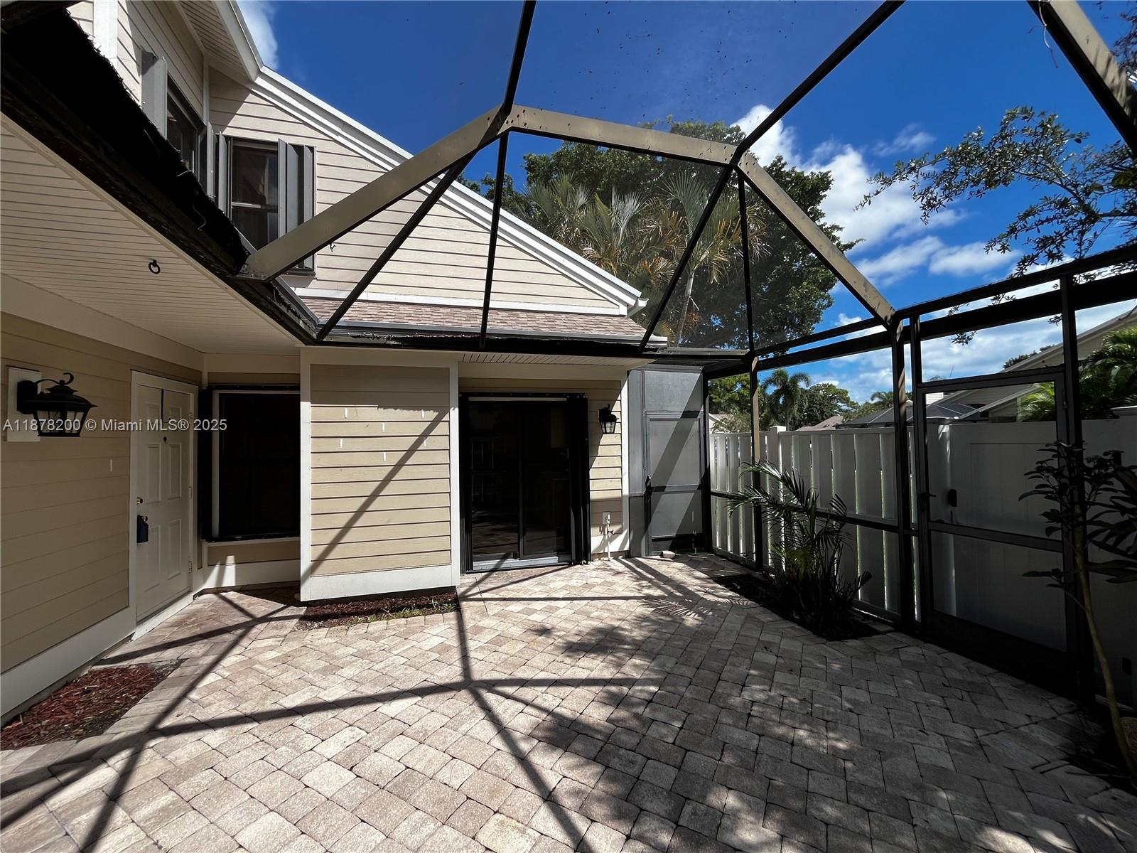 601 Summerwinds Lane Jupiter, FL 33458 - Photo 12 of 41 a house with trees in the background