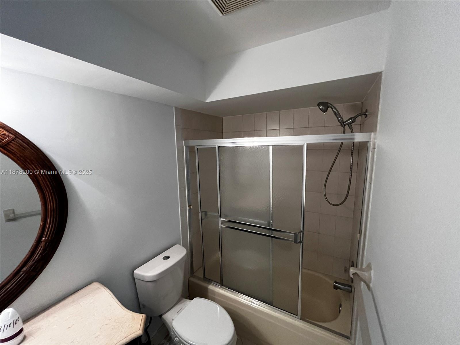 601 Summerwinds Lane Jupiter, FL 33458 - Photo 24 of 41 a bathroom with a toilet and a shower