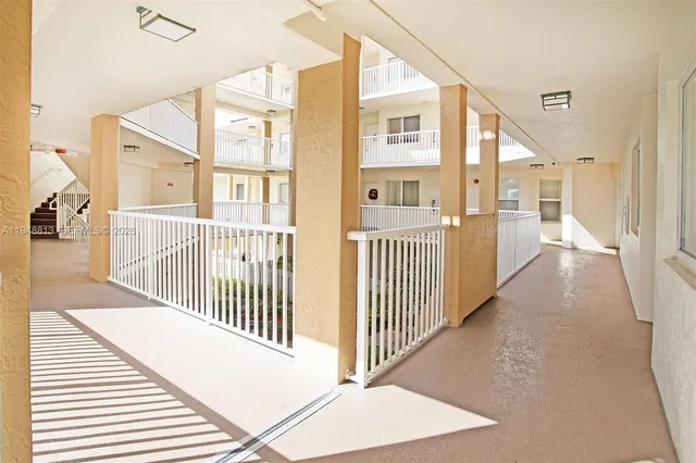 a view of a balcony with potted plants