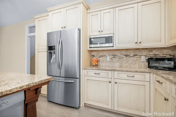 $990,000 | 4985 West Village Court Southeast, Ada, MI 49301