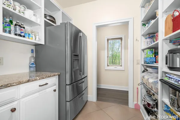 $990,000 | 4985 West Village Court Southeast, Ada, MI 49301