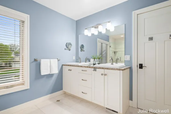 $990,000 | 4985 West Village Court Southeast, Ada, MI 49301