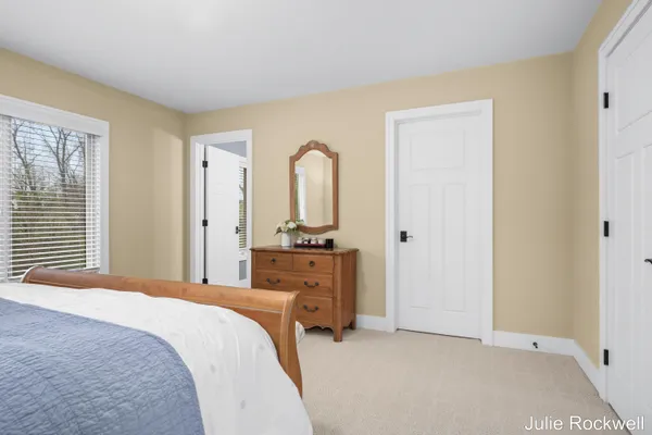 $990,000 | 4985 West Village Court Southeast, Ada, MI 49301
