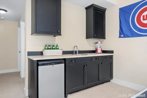 $990,000 | 4985 West Village Court Southeast, Ada, MI 49301