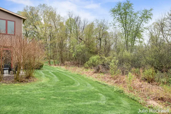 $990,000 | 4985 West Village Court Southeast, Ada, MI 49301
