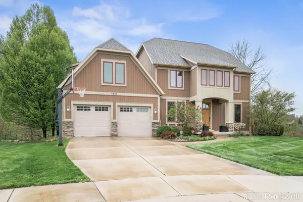 $990,000 | 4985 West Village Court Southeast, Ada, MI 49301