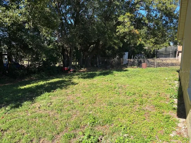 a view of backyard with green space