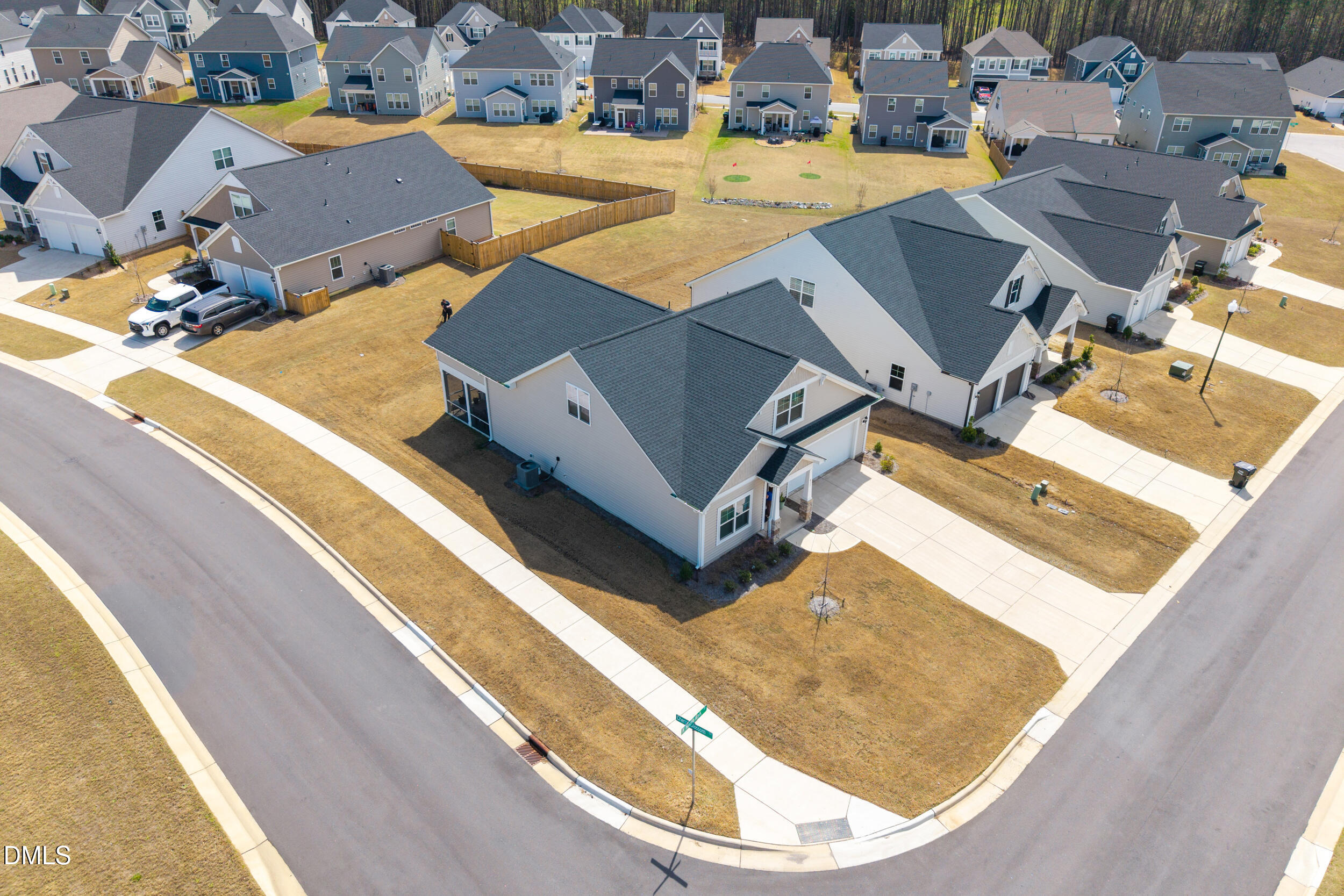 an aerial view of a house with a swimming pool