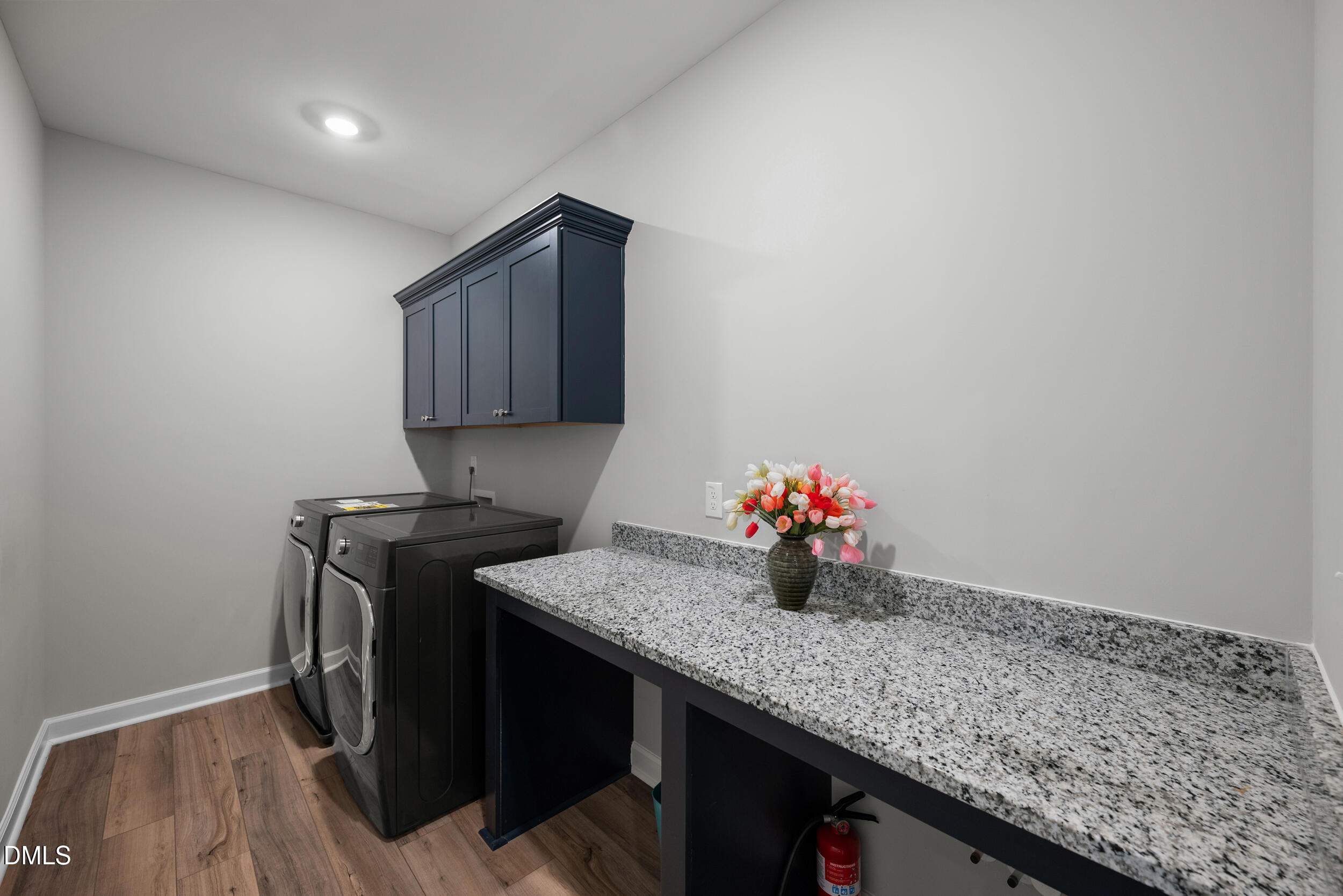 411 North Maple Walk Garner, NC 27529 - Photo 15 of 41 a kitchen with granite countertop a sink cabinets and stainless steel appliances