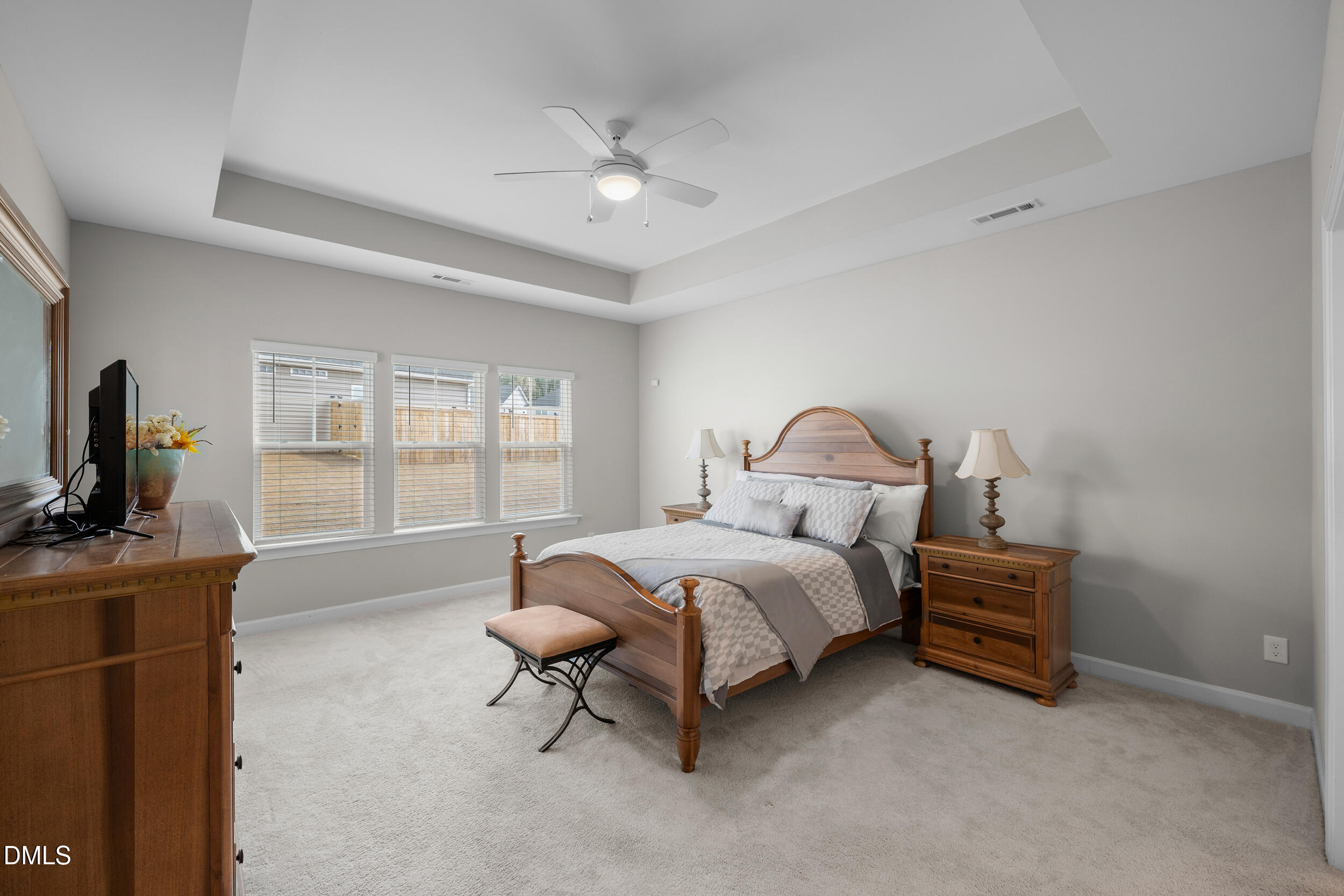 411 North Maple Walk Garner, NC 27529 - Photo 16 of 41 a bed room with a bed and a television