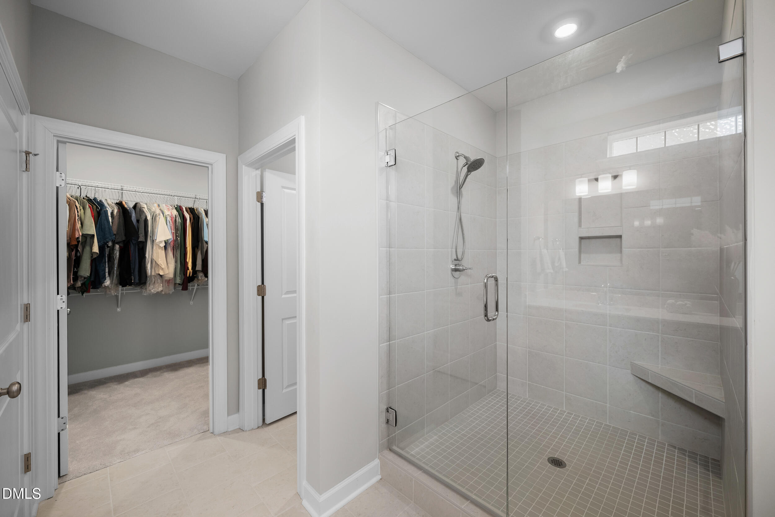 411 North Maple Walk Garner, NC 27529 - Photo 18 of 41 a bathroom with a shower and a glass door