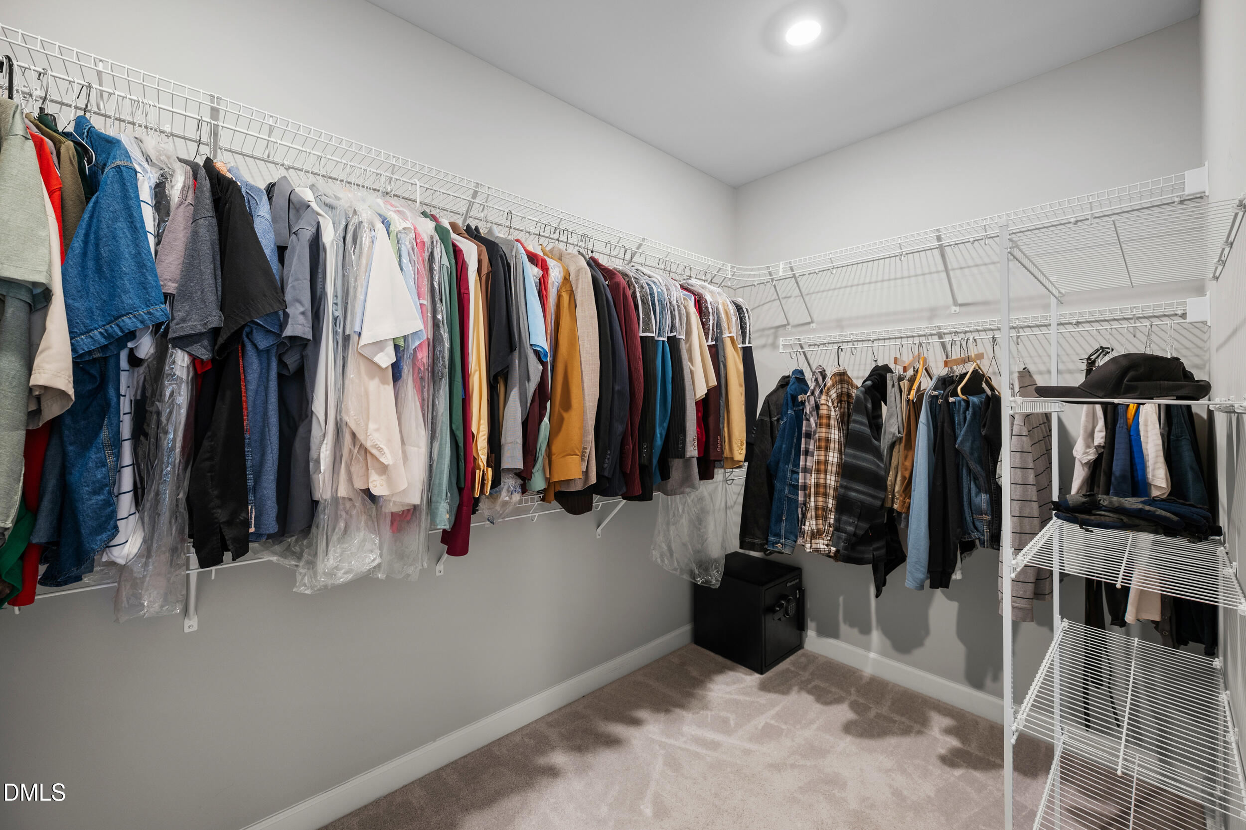 411 North Maple Walk Garner, NC 27529 - Photo 20 of 41 a view of walk in closet with clothes and shoes