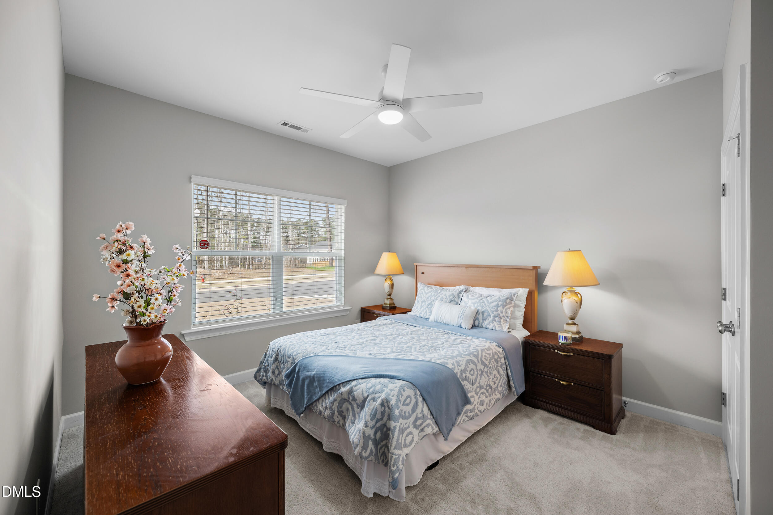 411 North Maple Walk Garner, NC 27529 - Photo 21 of 41 a bedroom with a bed and window