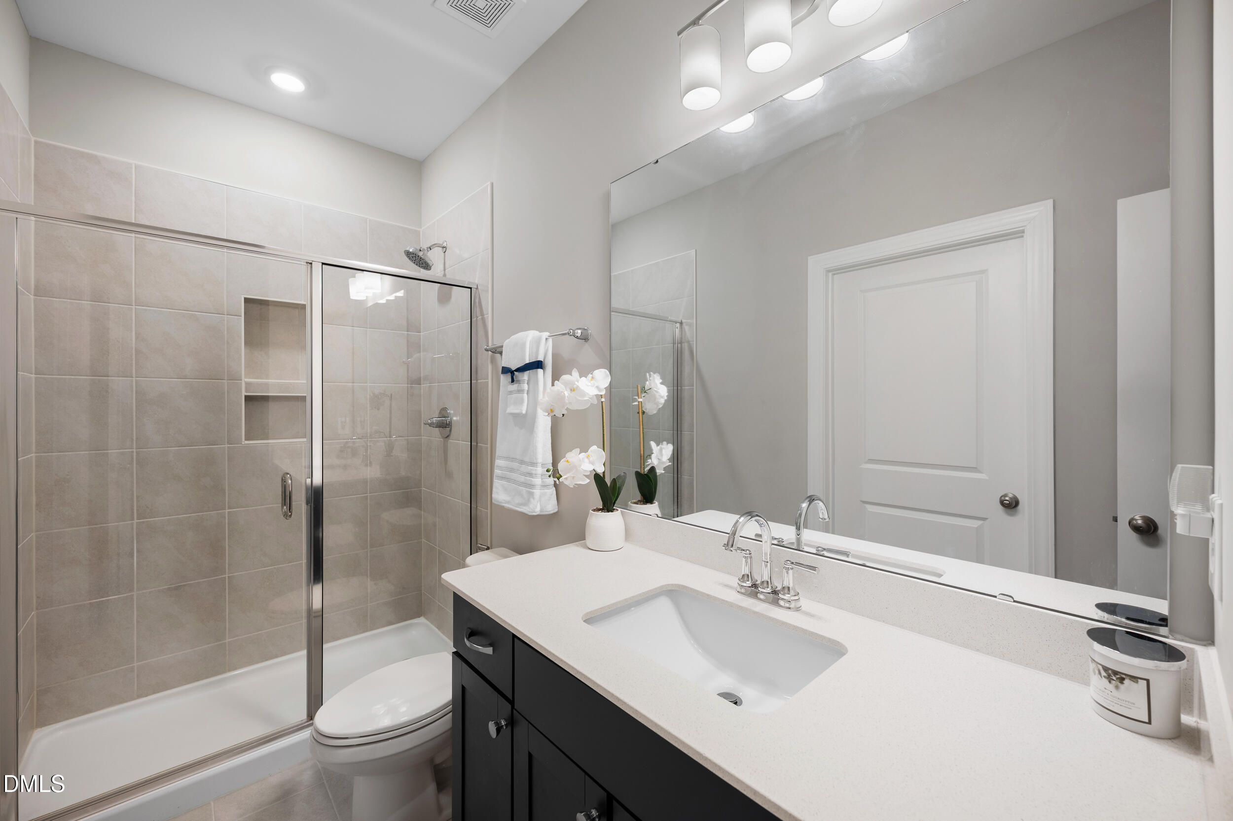 411 North Maple Walk Garner, NC 27529 - Photo 22 of 41 a bathroom with a sink toilet and shower