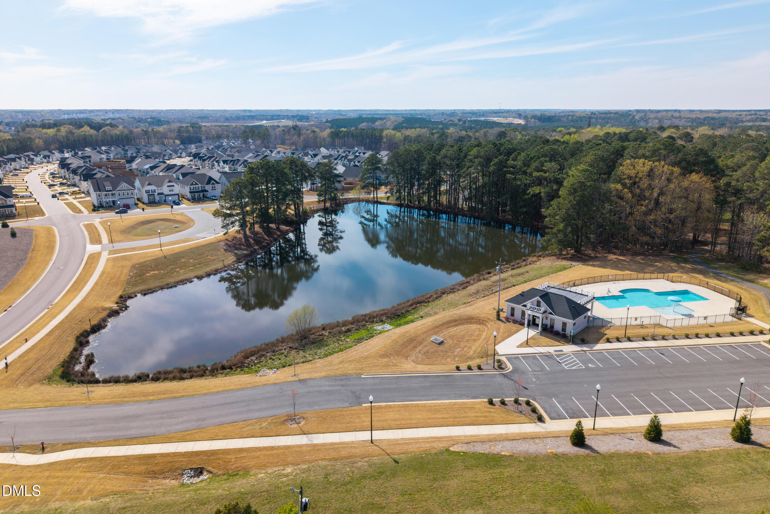 411 North Maple Walk Garner, NC 27529 - Photo 30 of 41 a view of a swimming pool with a lake view