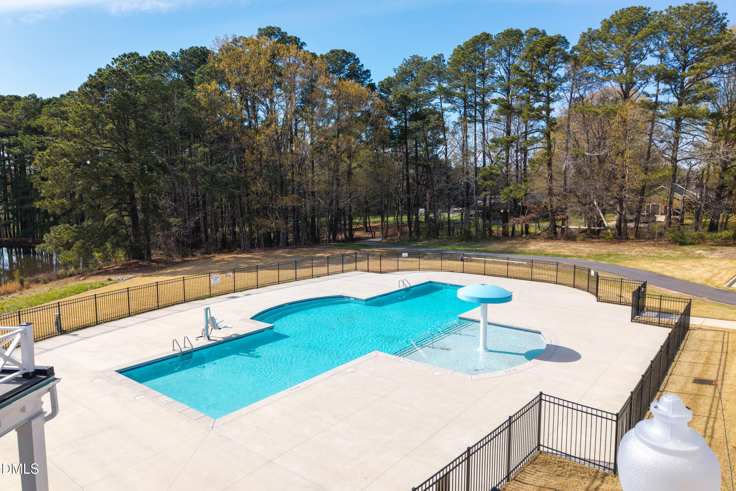 411 North Maple Walk Garner, NC 27529 - Photo 33 of 41 a view of a swimming pool with an outdoor seating and a yard