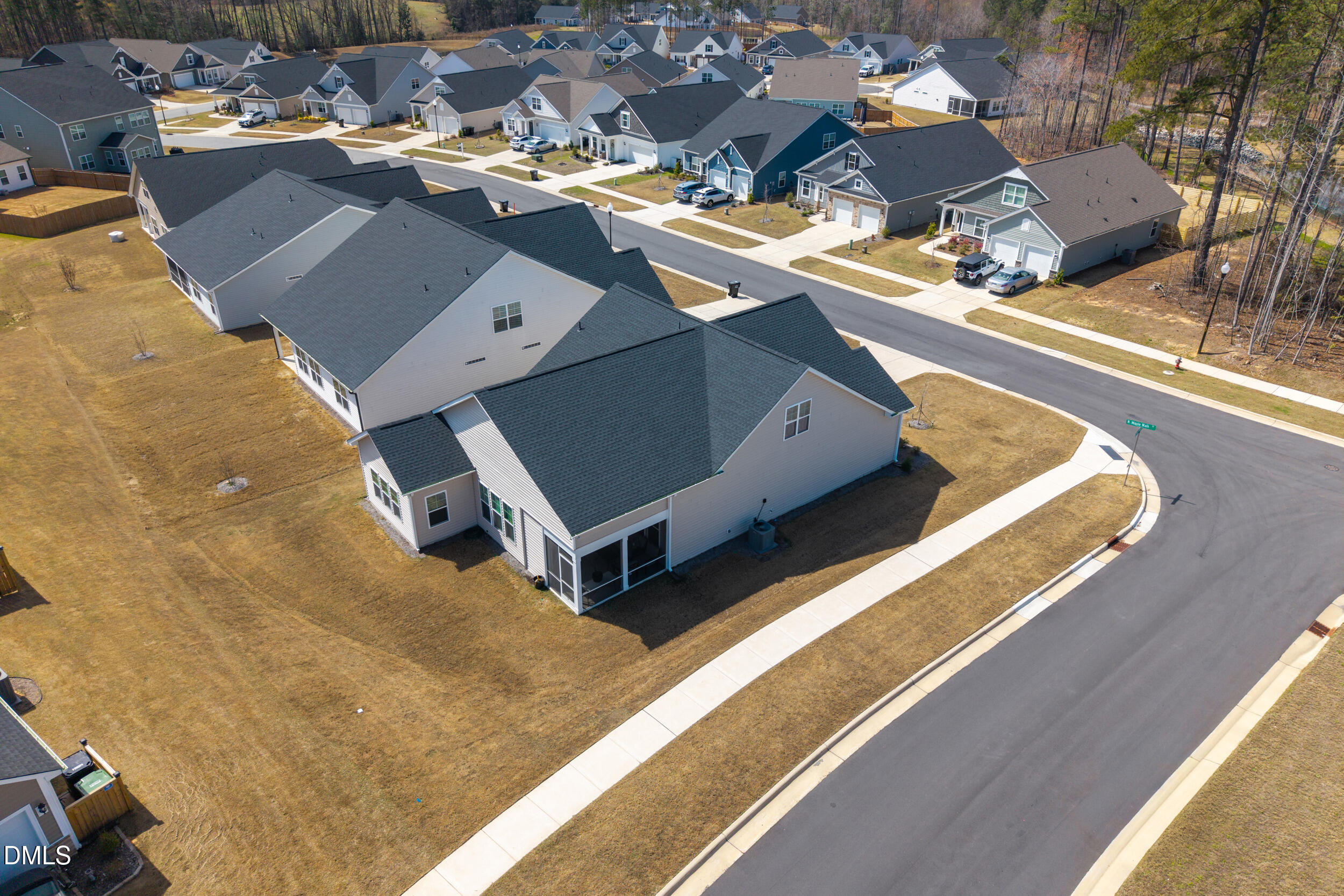 411 North Maple Walk Garner, NC 27529 - Photo 38 of 41 an aerial view of residential houses with outdoor space