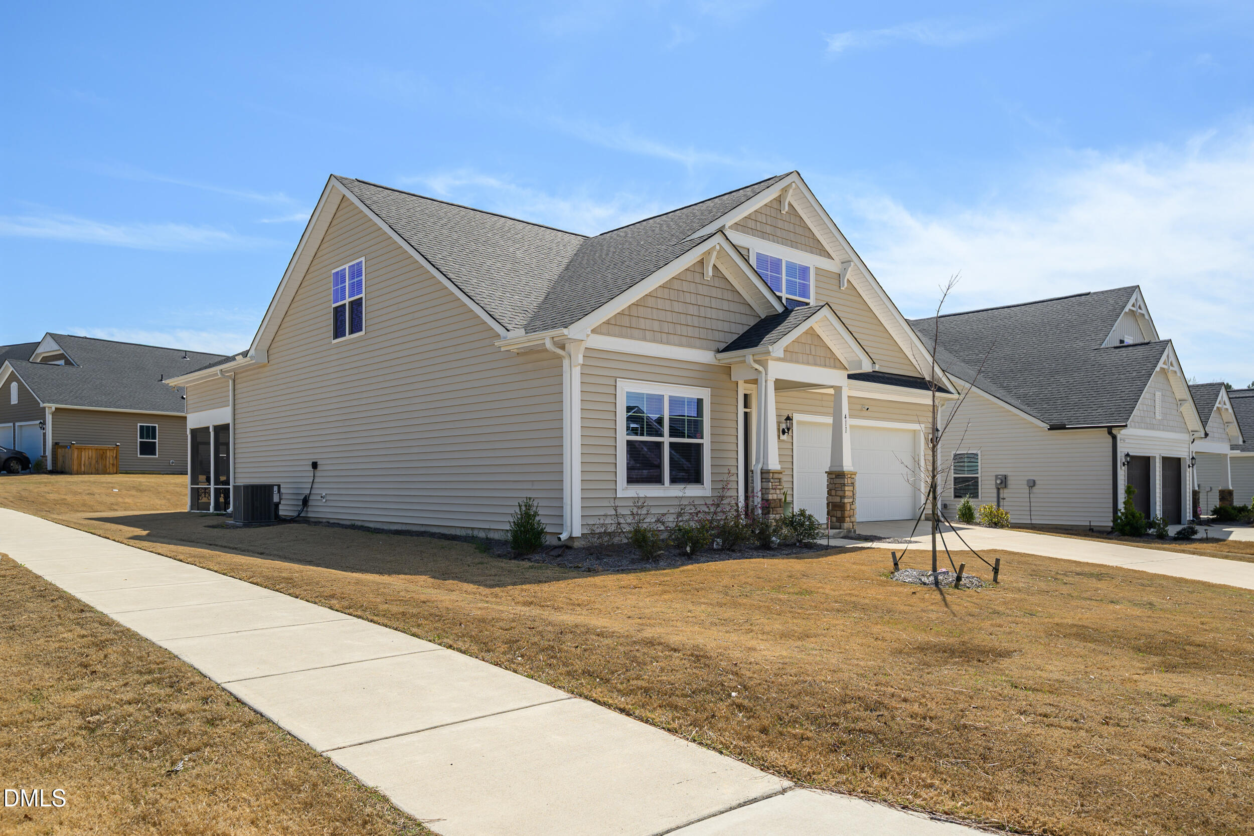 411 North Maple Walk Garner, NC 27529 - Photo 5 of 41 a front view of a house with a yard