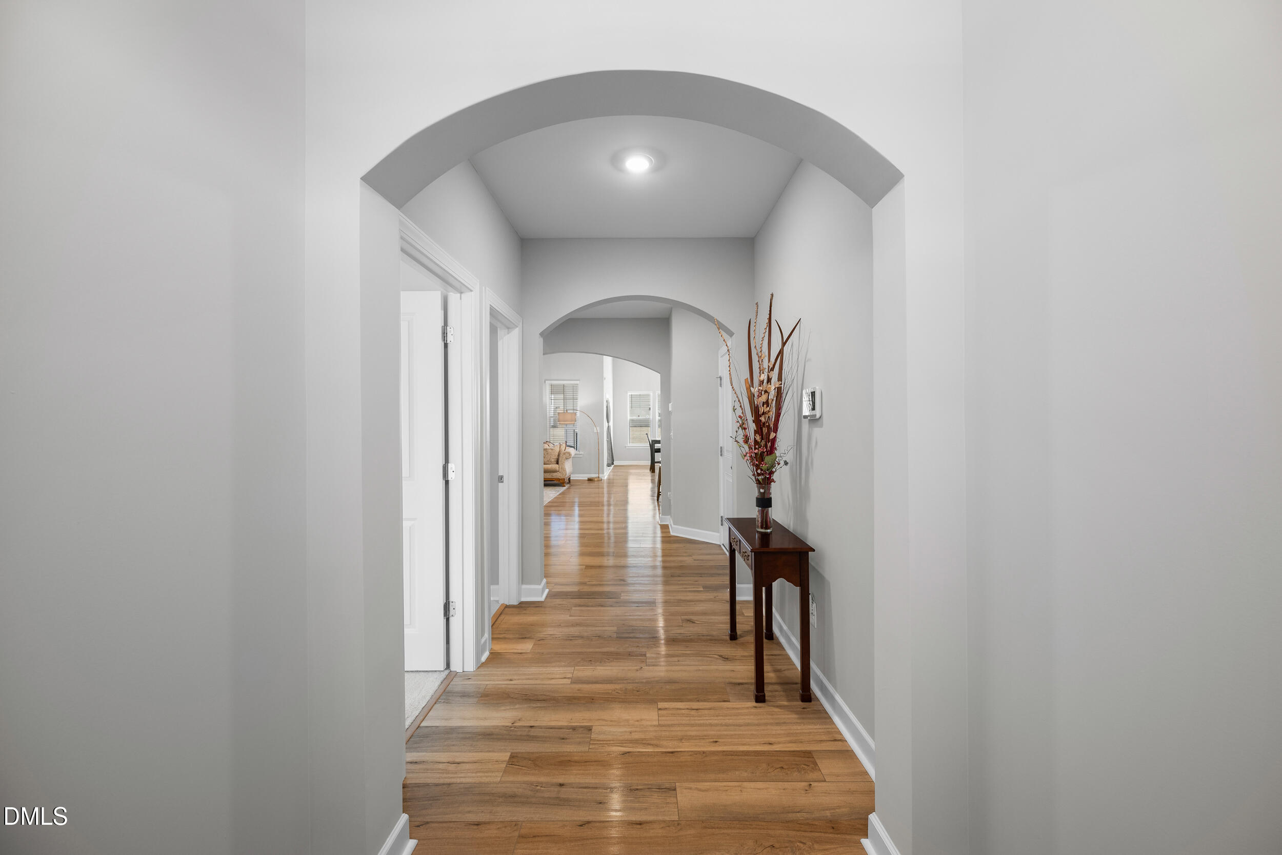411 North Maple Walk Garner, NC 27529 - Photo 7 of 41 a view of a hallway with wooden floor and entryway
