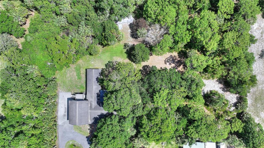 3641 Turtle Mound Road Melbourne, FL 32934 - Photo 66 of 77 an aerial view of a house with a yard