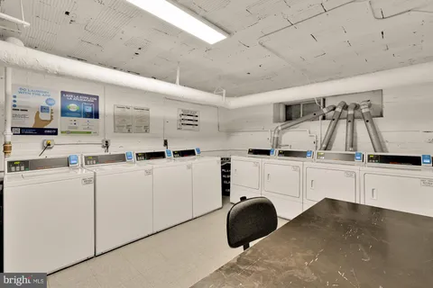 a kitchen with sink cabinets and window