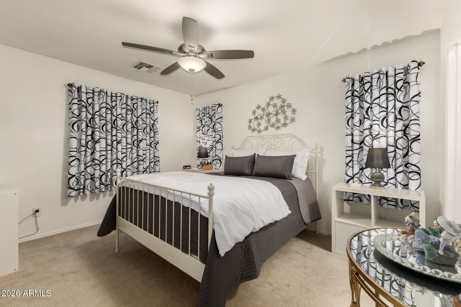 4676 East Redfield Road Gilbert, AZ 85234 - Photo 13 of 32 a bedroom with a bed and a table in it