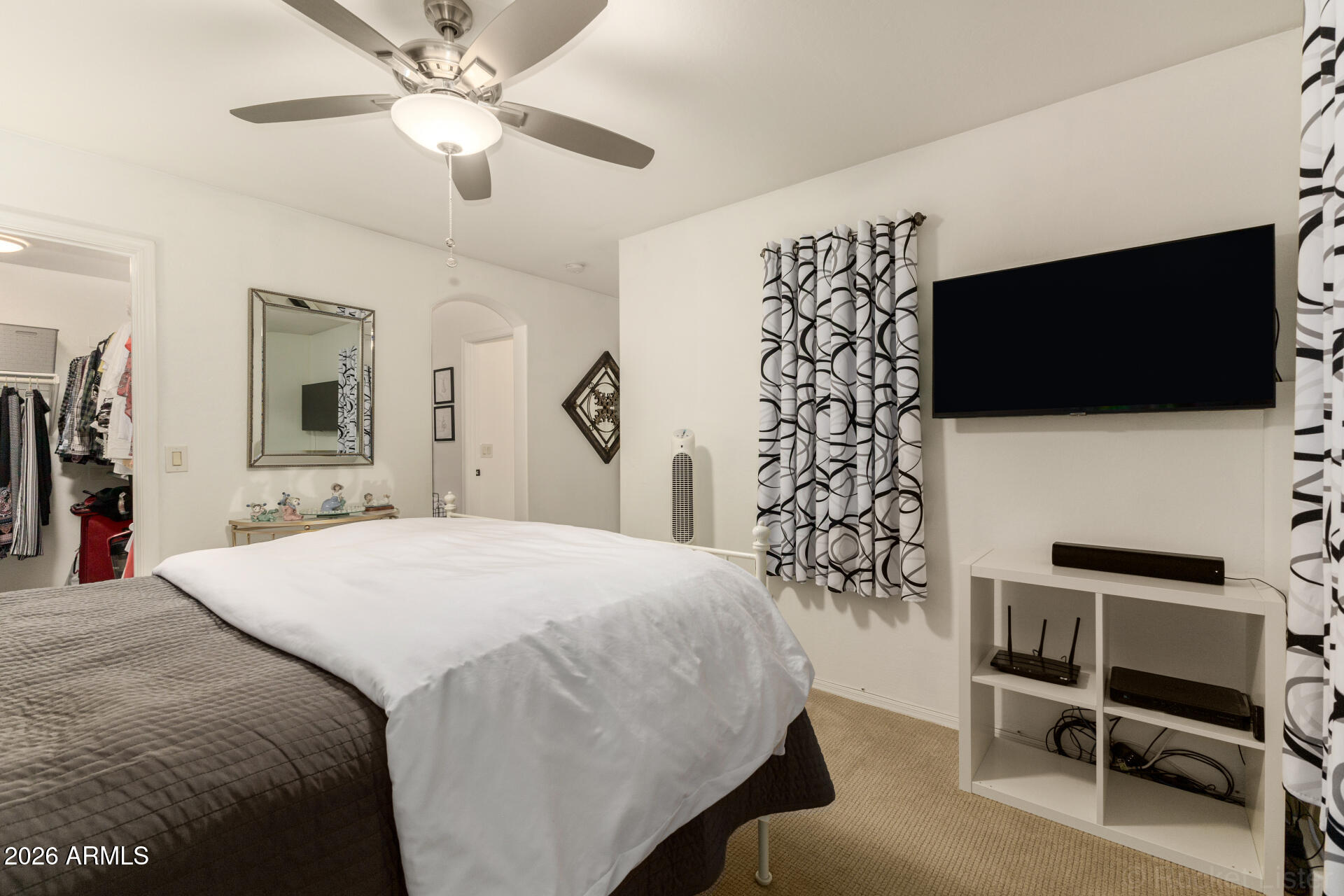 4676 East Redfield Road Gilbert, AZ 85234 - Photo 14 of 32 a bedroom with a bed and a flat screen tv