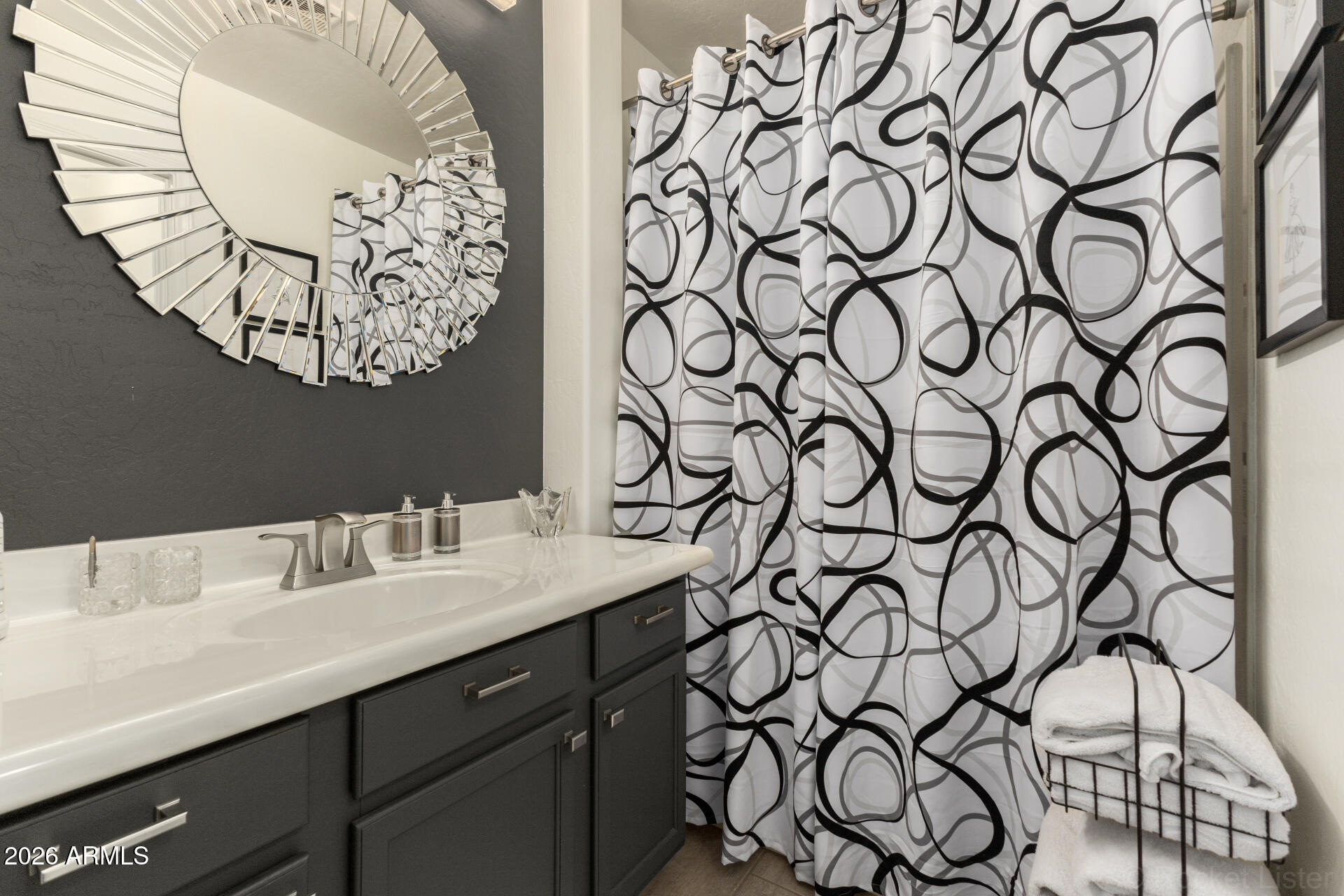 4676 East Redfield Road Gilbert, AZ 85234 - Photo 15 of 32 a bathroom with a mirror and a sink