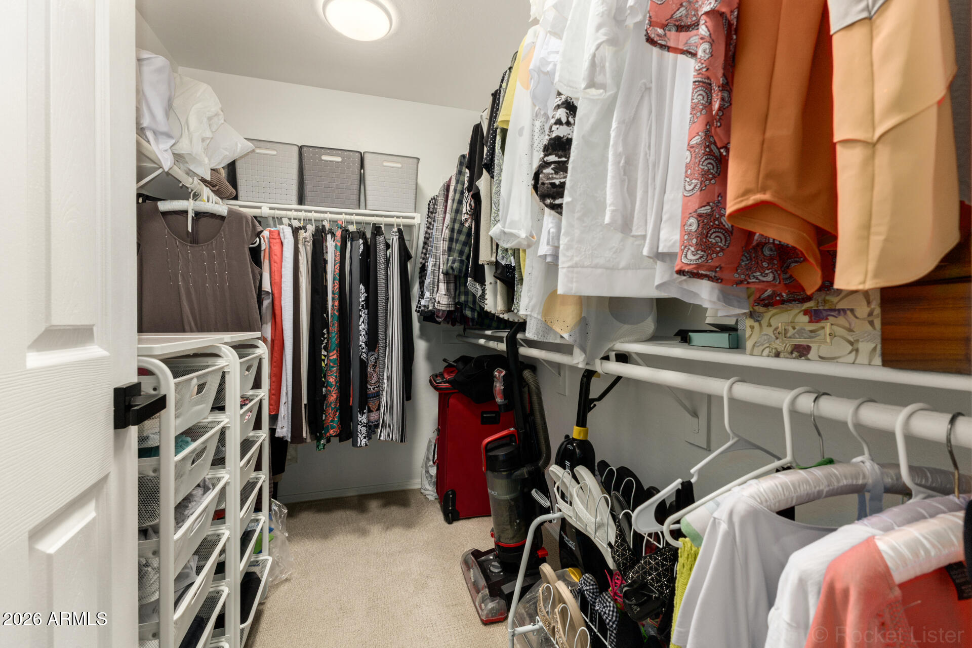 4676 East Redfield Road Gilbert, AZ 85234 - Photo 16 of 32 a view of walk in closet with clothes and shoes