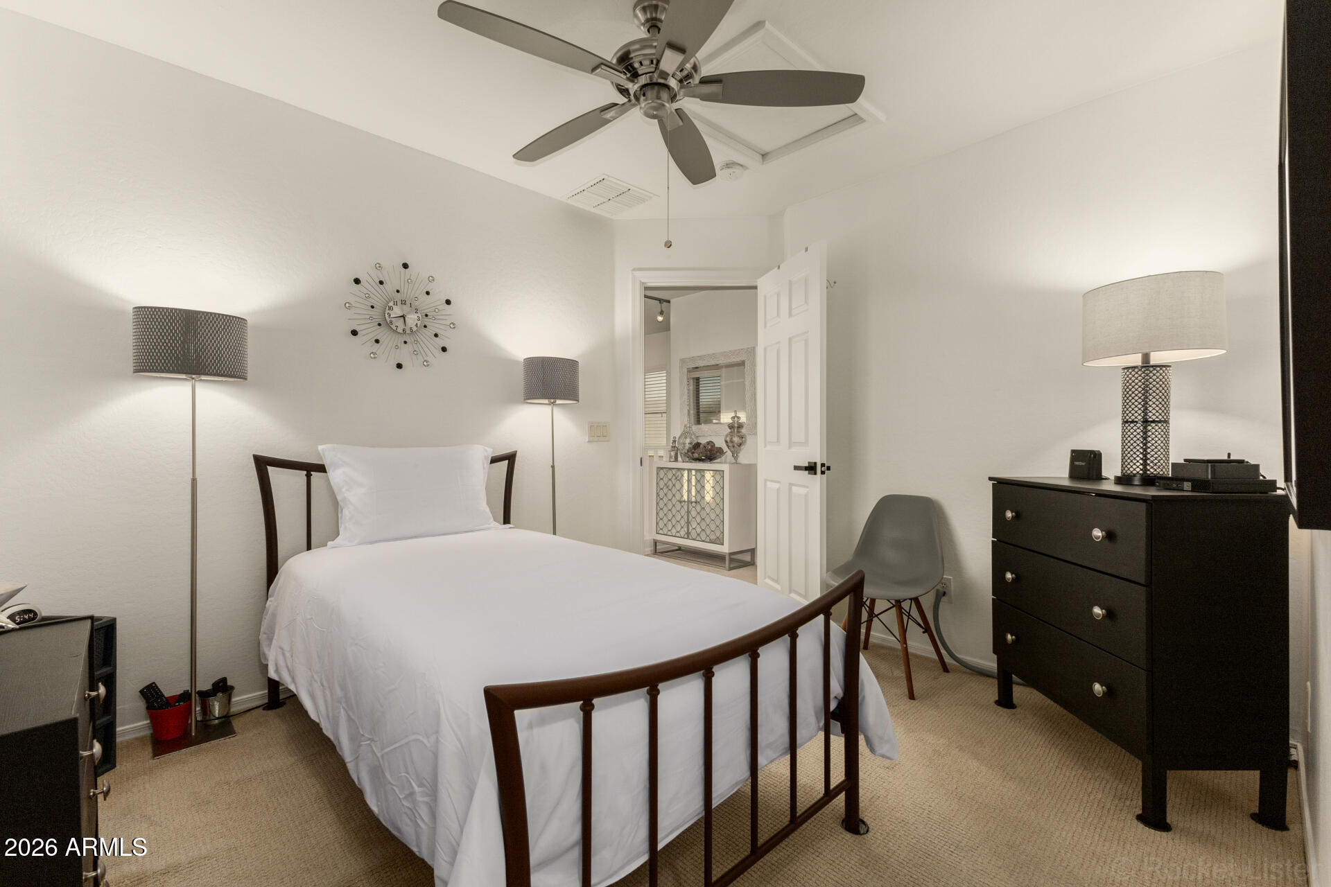 4676 East Redfield Road Gilbert, AZ 85234 - Photo 18 of 32 a bedroom with a bed and a chandelier