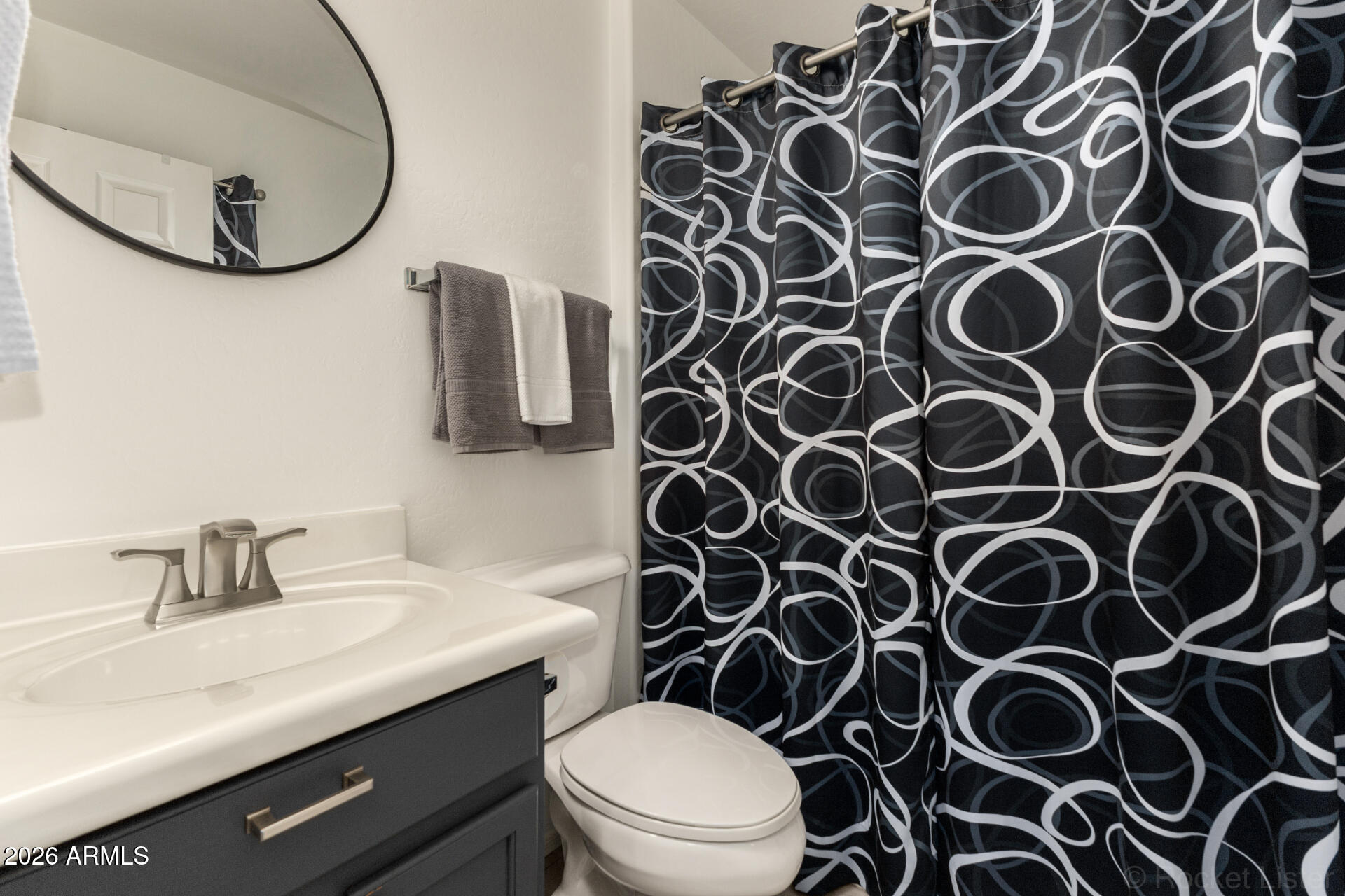 4676 East Redfield Road Gilbert, AZ 85234 - Photo 19 of 32 a bathroom with a sink and a mirror