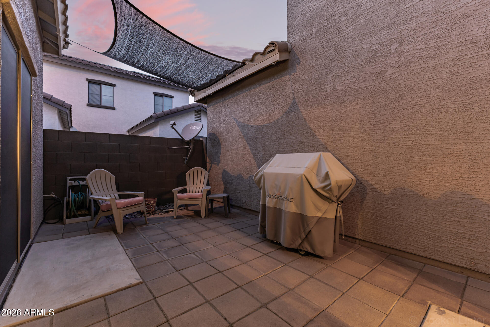 4676 East Redfield Road Gilbert, AZ 85234 - Photo 21 of 32 a view of a patio with table and chairs