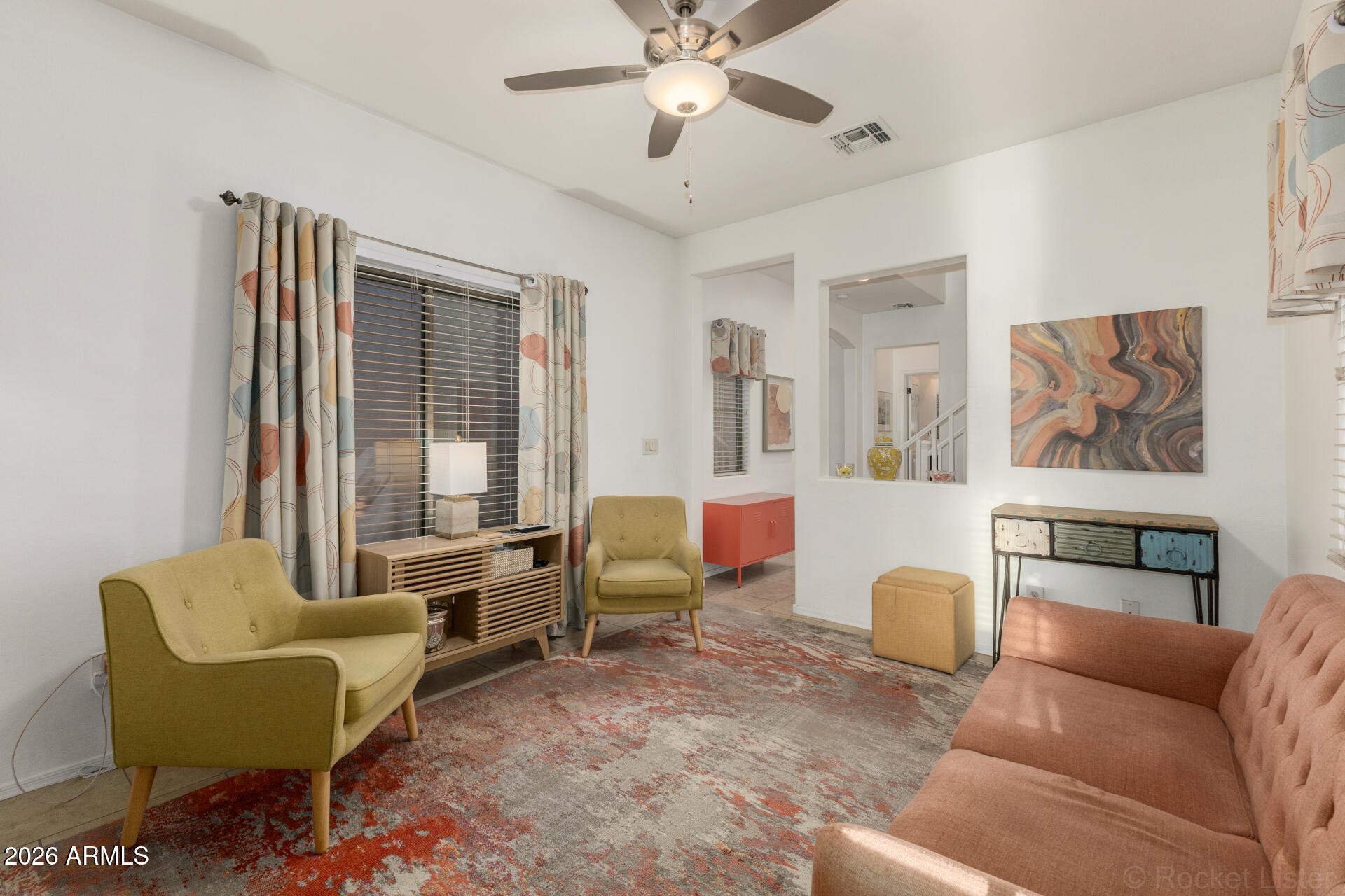 4676 East Redfield Road Gilbert, AZ 85234 - Photo 4 of 32 a living room with furniture and a large window