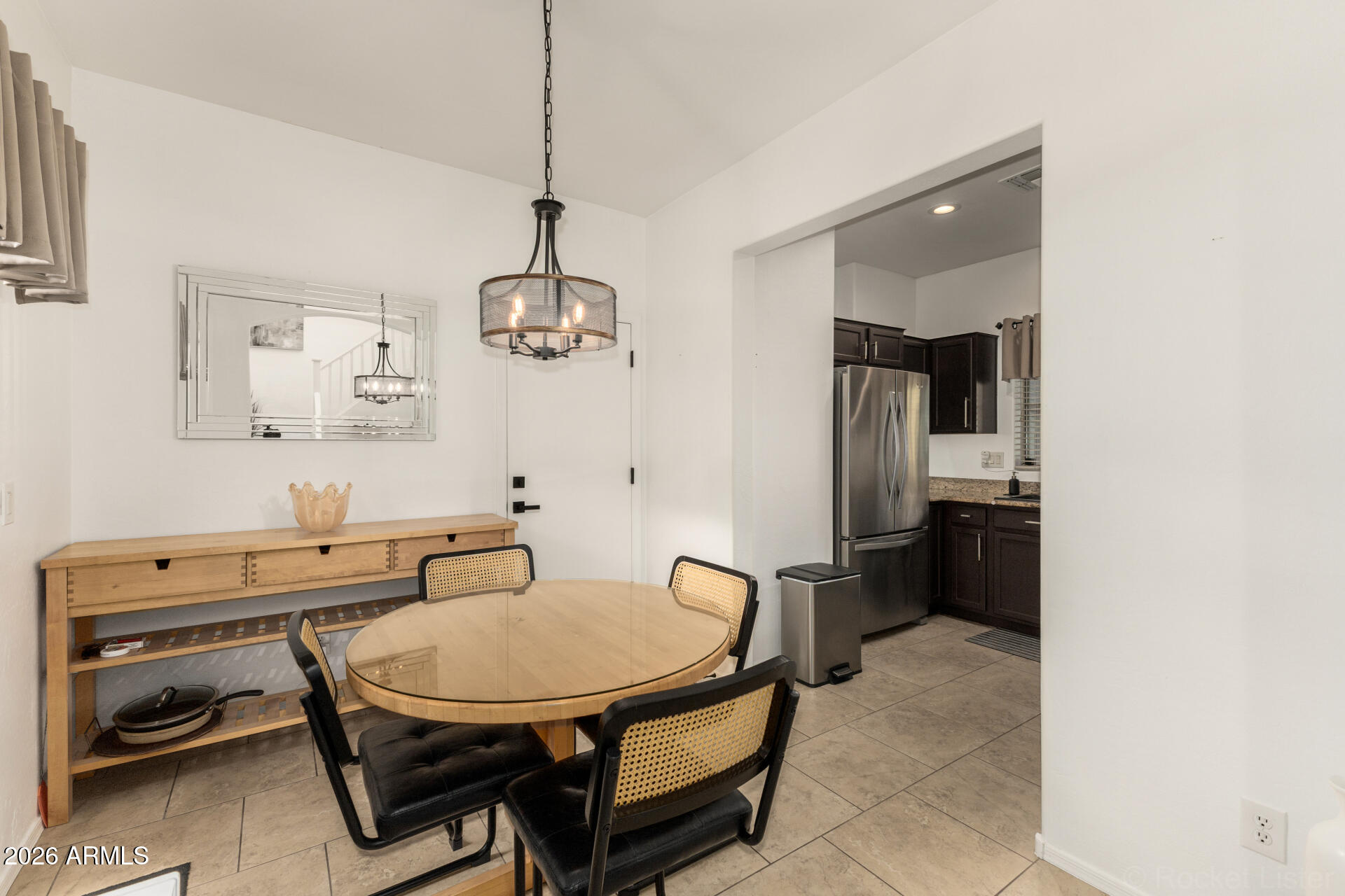 4676 East Redfield Road Gilbert, AZ 85234 - Photo 5 of 32 a room with a table chairs and a chandelier