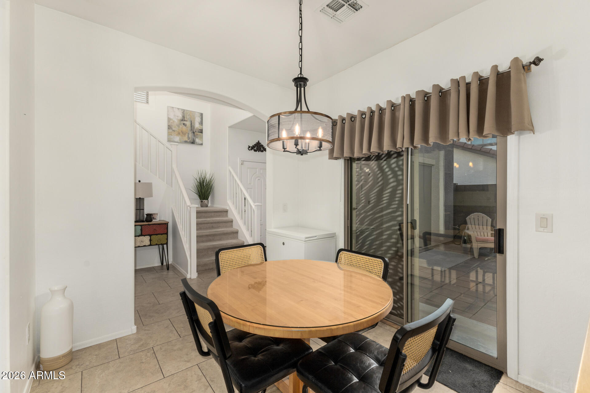4676 East Redfield Road Gilbert, AZ 85234 - Photo 7 of 32 a view of a dining room with furniture