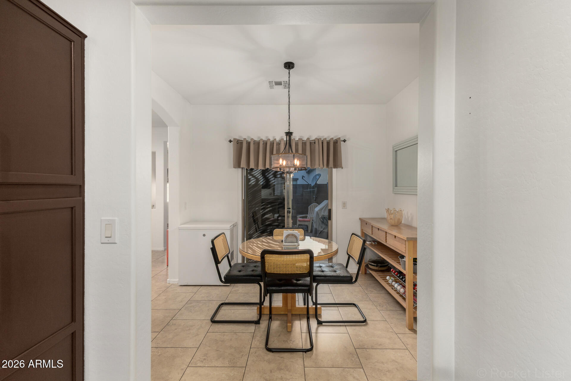 4676 East Redfield Road Gilbert, AZ 85234 - Photo 8 of 32 a dining room with furniture and window