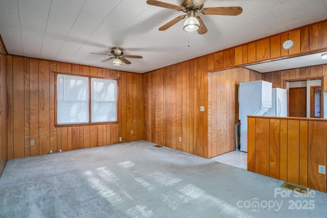 a kitchen with stainless steel appliances granite countertop a stove a sink and a cabinets
